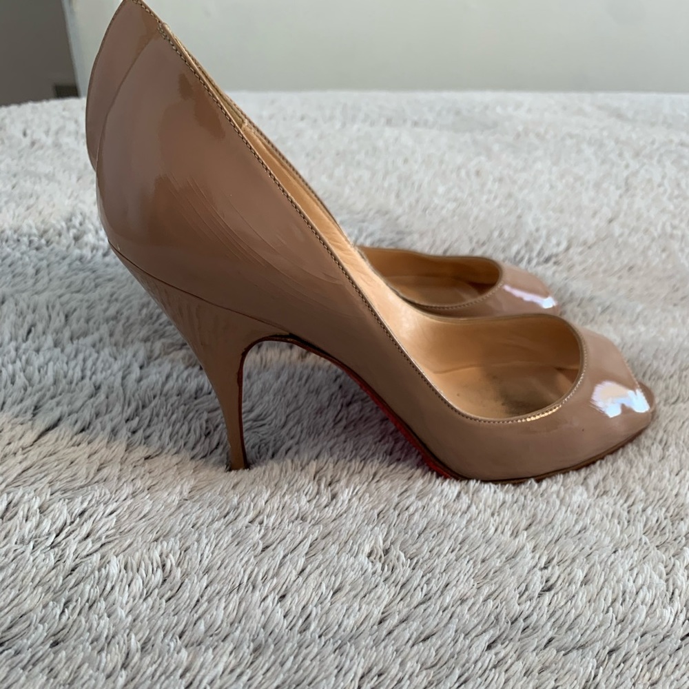 Christian Louboutins peep toe pumps